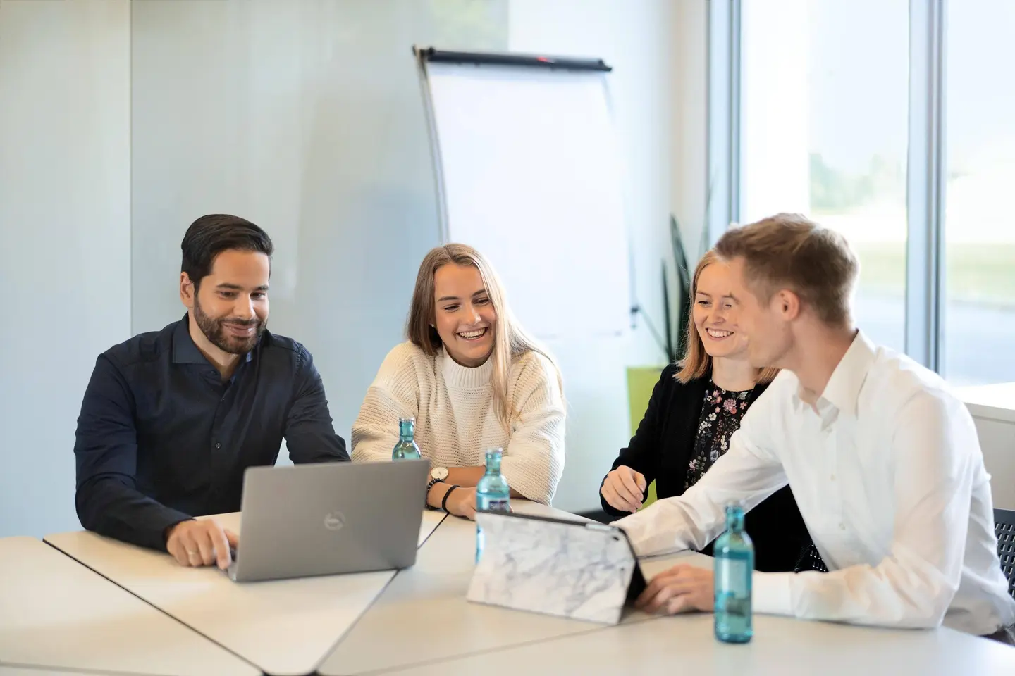 Picture - Four people sitting in a meeting room