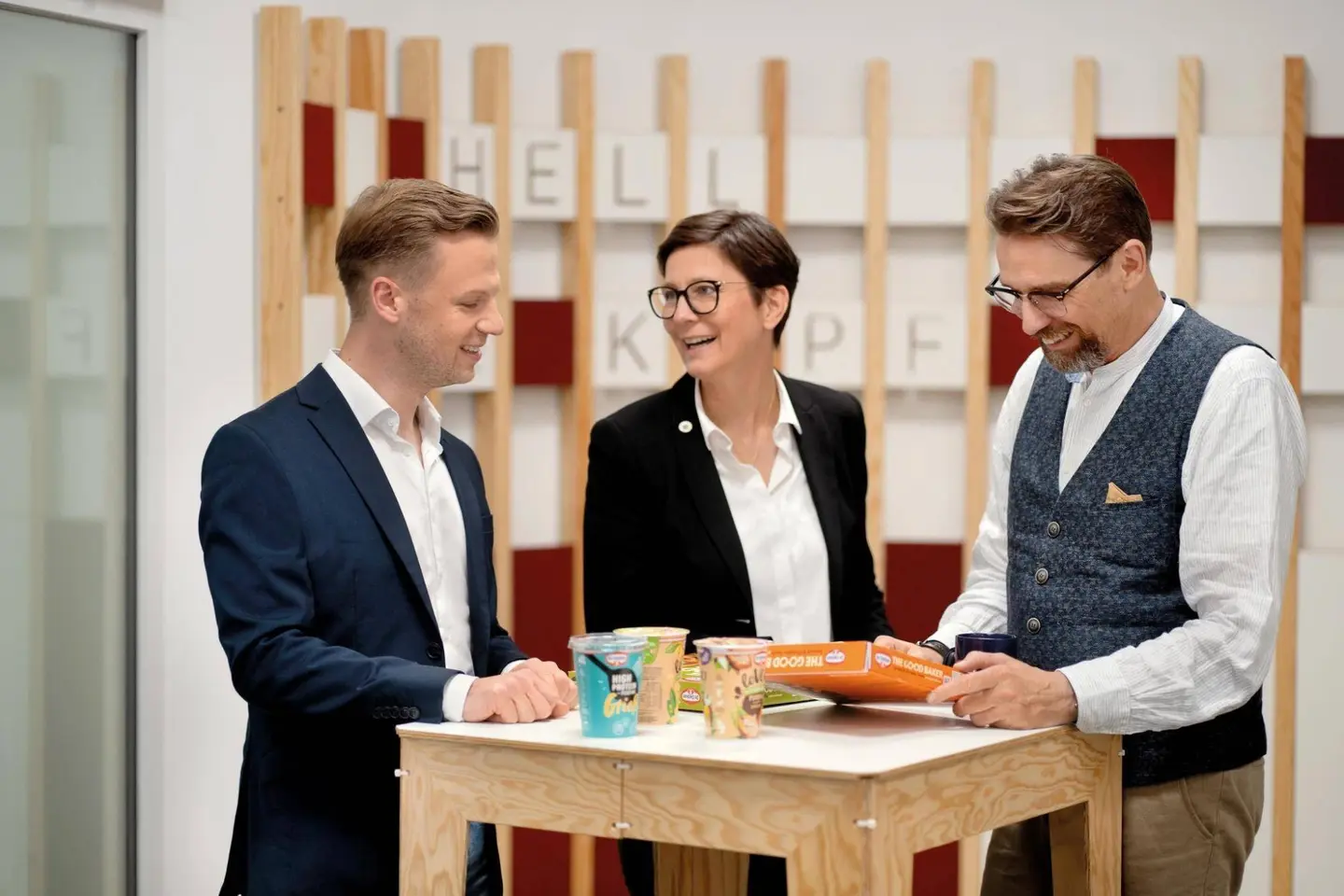 Picture - Three Dr. Oetker employees with products